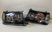 Фары (оптика) черные Toyota Land Cruiser 100 1998-2002